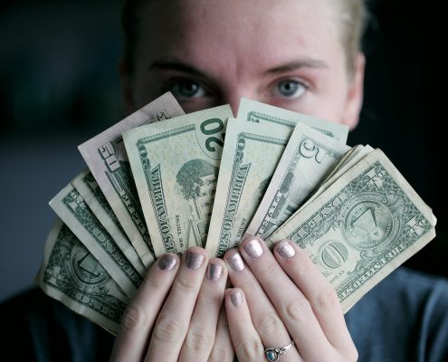 Student holding money